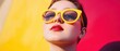 © Riya - Stylish woman in yellow sunglasses posing against vibrant background