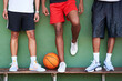 © peopleimages.com - Legs, men and basketball players on bench for training, practice and workout for match. People, teammates and break for sports with fitness for games, championship and tournament as talent or skill