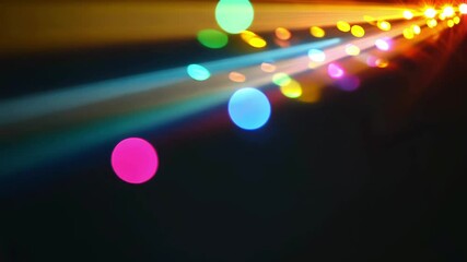 Abstract Colorful Light Rays with Bokeh Effects Creating a Vibrant Spectrum