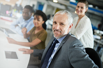 Poster - Portrait, man and business people in meeting, opportunity and magazine agency with news room. Office, group and employees with tech, journalist or editing with mature person and research for project