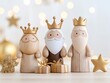 © Dina - Three Kings figurines with crowns and a star, representing the Epiphany, on a festive background
