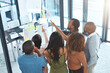 © peopleimages.com - Business people, glass and collaboration in office for planning, brainstorming and project management. Creative agency, top view and pointing in workplace for discussion, development and strategy