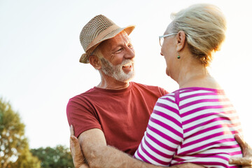 Wall Mural - woman man outdoor senior couple happy lifestyle retirement together smiling love old nature mature e