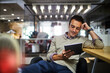 © Geber86 - Young man using a digital tablet while working in a startup company office