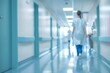 © Vorda Berge - Blurred background of a doctor and nurses in hospital interior