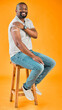 © peopleimages.com - Black man, vaccine and happiness in studio background with plaster for prevention and protection in Uganda. Male person, smile and healthcare or covid with bandage for virus immunity on portrait