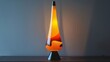 © Justlight - A throwback plastic lava lamp in a striking yellow and orange color scheme.