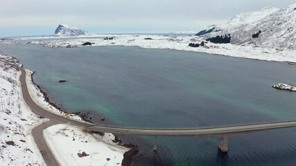 Wall Mural - 4k drone flight moving to the side footage (ultra high definition) of gimsoystraumen bridge. dramati
