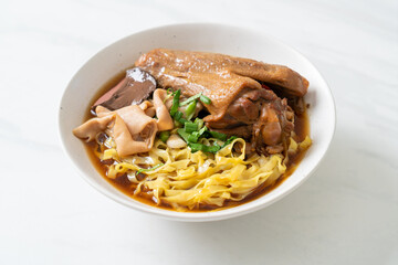 Wall Mural - egg noodles with stewed and braised duck in brown soup