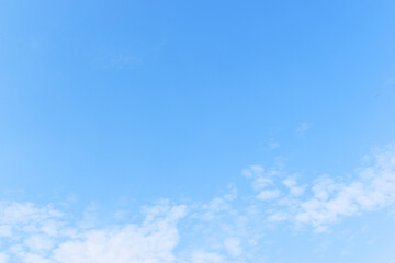 Wall Mural - beautiful blue sky and white fluffy group of clouds with sunrise in the morning, natural background