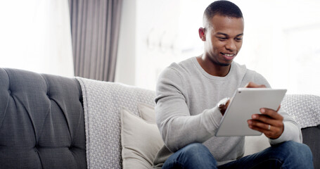 Poster - House, typing and black man on sofa, tablet and connection with website info, relax and social media in lounge. African person, apartment and guy on couch, technology and communication with network