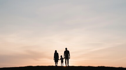 silhouette of a family at sunset.
