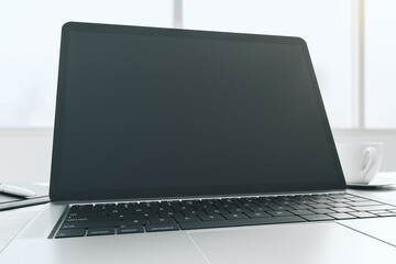 Poster - Wide angle shot with blank black modern laptop screen with copyspace for your logo or text on sunny window background. 3D rendering, mockup
