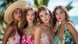 © Fana Art - Four beautiful young women with tanned skin and long hair are looking directly at the camera. They are wearing colorful summer dresses and jewelry.