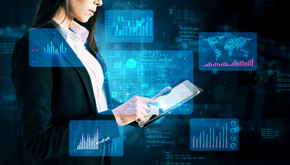 Aufkleber - Businesswoman Analyzing Virtual Financial Data on Tablet.