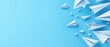 © Peerarut - Straight line of paper planes on solid blue background clean aesthetics journey or progress concept with minimal theme