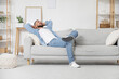 © Pixel-Shot - Young man resting on his day off at home