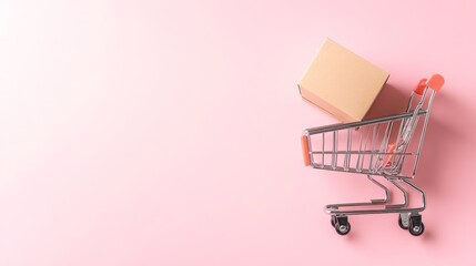 Poster - Miniature shopping cart carrying cardboard box lying on pink background, representing online shopping, delivery and e commerce