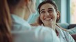 © vefimov - Woman doctor greeting her patient with a smile.
