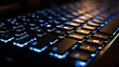 © Galib - A backlit keyboard with blue lighting.
