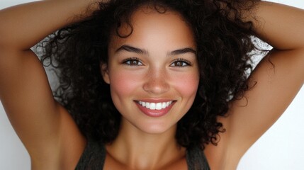 Poster - A woman with curly hair is smiling and has her arms raised