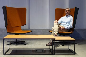 Wall Mural - Handsome businessman looking seriously in the office lounge.