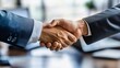 © Ilja - Business Partnership Agreement. Shaking Hands After Successful Business Deal in Office Setting.