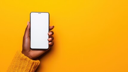 Poster - Hand Holding Smartphone with Empty Screen over Bright Yellow Background, Perfect for Technology, Communication or Social Media Themes