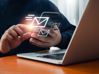 Poster - SMS sending, Email or message send, communication technology concepts. Fast moving of envelope, digital letter icons appearing while business person using phone and working with laptop computer.