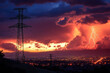 © Steven - Dramatic lightning illuminates the evening sky over a bustling city, with silhouettes of power lines adding depth to the vibrant, stormy sunset scene.