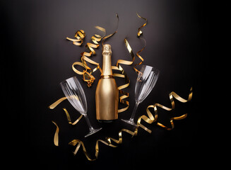 Poster - A single gold bottle of champagne sits between two champagne flutes surrounded by gold ribbon on a black background.