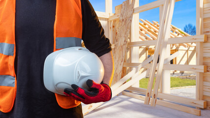 Poster - helmet in hand builder. foreman at construction site. hardhat for head protection. employee of archi