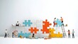 © NKCoolper - Diverse Workforce Collaborating to Accomplish Shared Goals through Teamwork and Puzzle Building  Men and women working together to solve challenges build connections and achieve success
