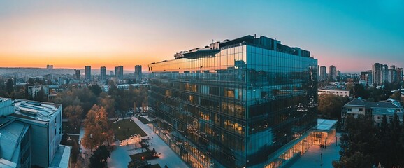 Poster - Modern Glass Building in City at Sunset.
