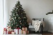 © SEUNGJIN - Interior of festive living room with grey armchair and gift boxes under Christmas tree