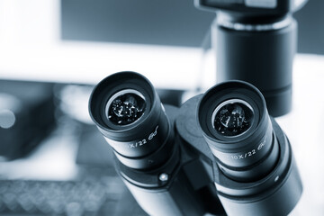 Poster - Two microscope eyepieces close-up in a laboratory