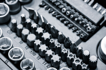 Poster - A toolbox with many different sized tools. The toolbox is black and white. The tools are arranged in rows and columns
