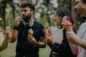 Poster - A group of college students and a professor take a break with ice cream. They are enjoying the moment and sharing ideas in a relaxed outdoor setting.