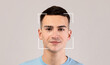 © Prostock-studio - Smiling young caucasian male, double exposure with id scan, isolated on light background. Futuristic and technological face scanning for face recognition and person. Personal safety, future, security