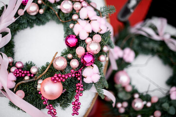 Wall Mural - Top view of two Christmas wreaths made of Christmas tree branches, focus on the foreground