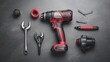 © Sampao - Close-Up Arrangement of a Red Cordless Drill Surrounded by Hand Tools and Accessories on a Dark Background for DIY and Repair Projects