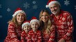© Daniel - Portrait of happy family with matching Christmas pyjamas on a blue snowflake background.