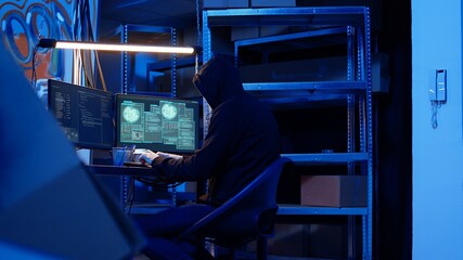 Poster - rogue computer expert in graffiti sprayed hideaway targeting vulnerable unpatched connections, focus