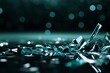 © Maxim - Teal glass shards scattered on a glossy dark surface with blurred bokeh lights in the background, creating a calm yet intense visual contrast