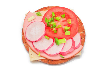 Wall Mural - Crispy Cracker Sandwich with Tomato, Sausage, Cheese, Green Onions and Radish - Isolated on White. Easy Breakfast. Diet Food. Quick and Healthy Sandwiches. Crispbread with Tasty Filling - Isolation