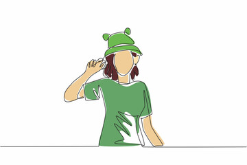 Poster - Continuous single line drawing of young beauty and energetic woman wearing funny cute frog animal character hat. Vector graphic illustration. National Hat Day