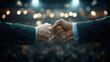 © Worakit - Fists clashing in symbolic gesture of conflict, representing political rivalry between two parties. background features blurred lights, enhancing dramatic effect