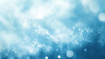 Poster - Soft blue abstract background with delicate light spots and reflections creating a dreamy and ethereal atmosphere