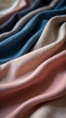 Poster - A blue, pink, and purple fabric is folded and displayed