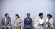 © peopleimages.com - Man, portrait and queue for interview at office with diversity, networking or onboarding at recruitment company. Person, row and waiting room for human resources, people and mock up space at agency